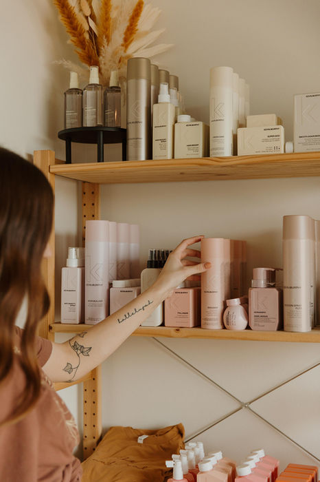 Kevin Murphy hair-care product held in hand at The Natural